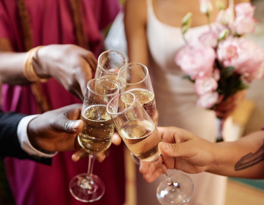 Toasting with Champagne glasses during wedding reception party